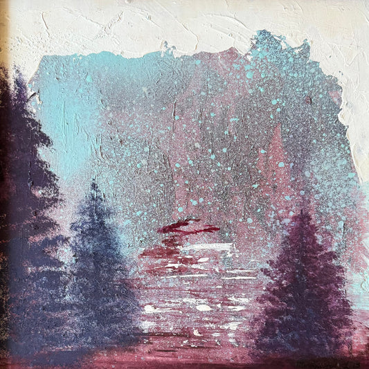 A framed landscape painting featuring dark pine tree silhouettes against a textured background of teal, pink, and purple brushstrokes, set in a rustic brown wooden frame.