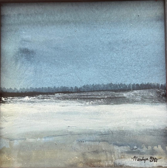 A framed landscape painting featuring a muted blue sky and a pale, icy field, housed in a distressed dark brown wooden frame.